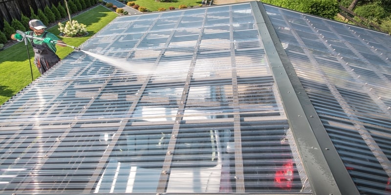 PVC corrugated roofing sheet being cleaned