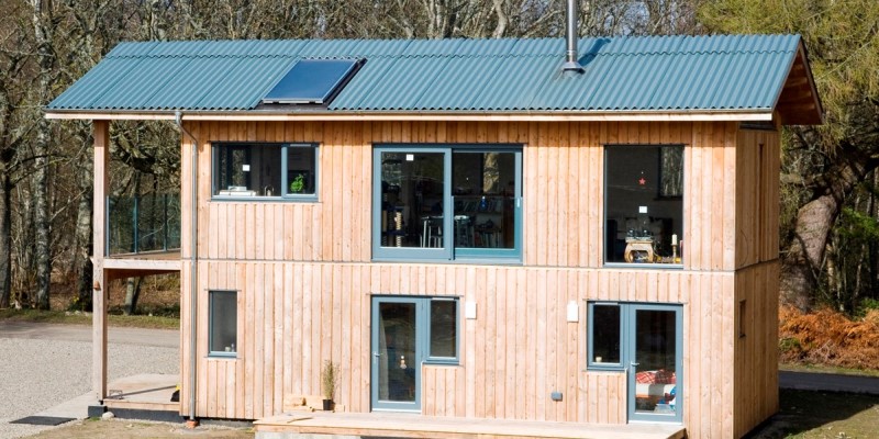 two storey wooden cabin with fibre cement roof